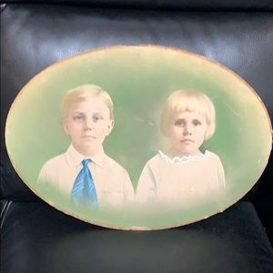 Antique picture of 2 children, bowed cardboard